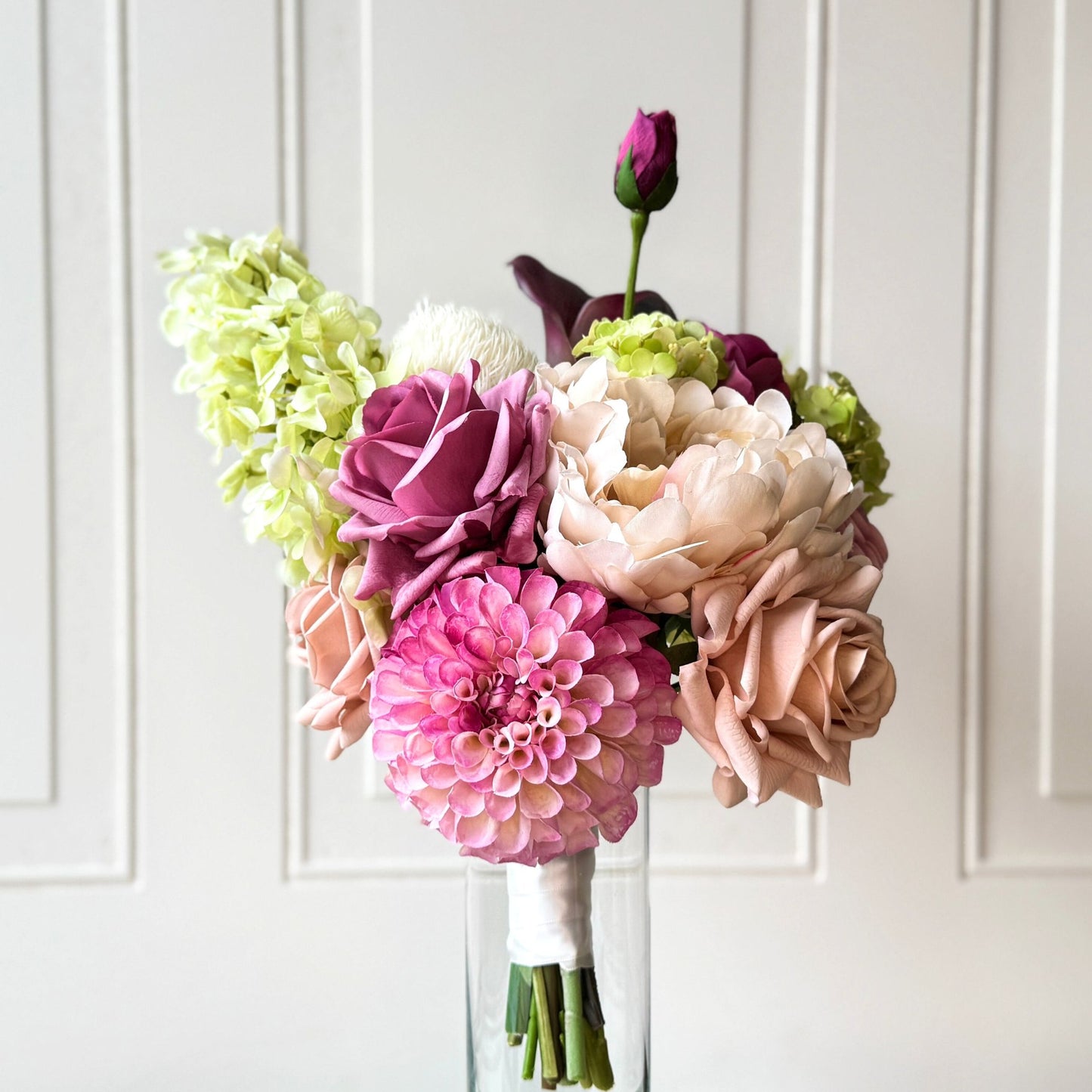 realistic artificial flower bridal bouquet featuring antique cream artificial roses, dusty mauve artificial roses, blush artificial peonies, pink artificial dahlias, pale green artificial hydrangeas, green artificial peonies, and deep wine artificial calla lilies —  Real Touch Flowers from My Faux Florist Canada.