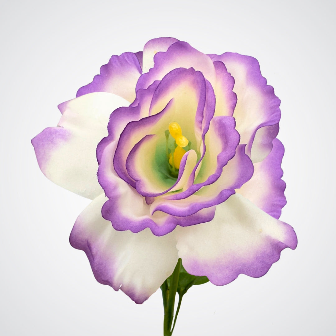 Close-up of a purple and white fake lisianthus flower on a light gray background from My Faux Florist Canada