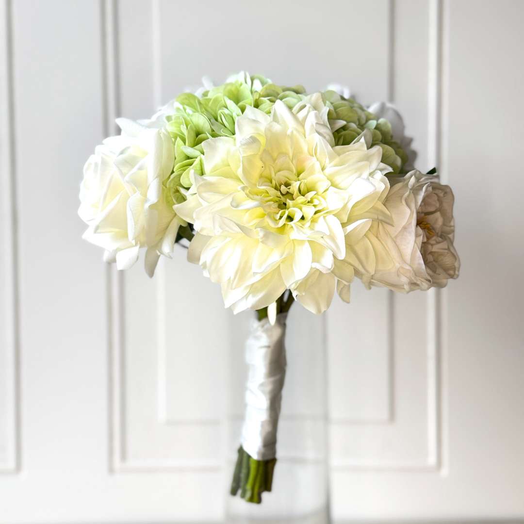 realistic artificial flower bouquet featuring white artificial roses, white artificial dahlias, and pale green artificial hydrangeas — from My Faux Florist Canada.