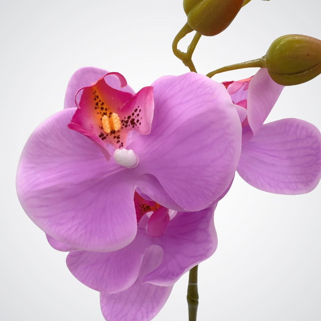 Close up view of 3 petals on a bright pink fuchsia artificial orchid flower with Real Touch petals by My Faux Florist Canada.