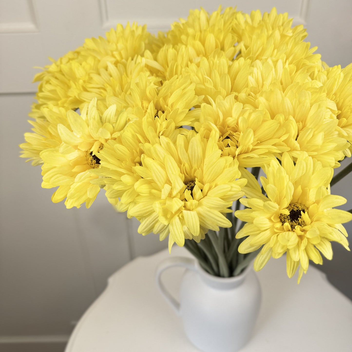 bright yellow fake gerbera daisies in a white vase with white background from My Faux Florist Canada