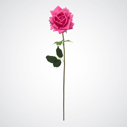 Single artificial flower on white background.  Full length view of realistic fuchsia pink artificial rose with realistic Real Touch bloom.