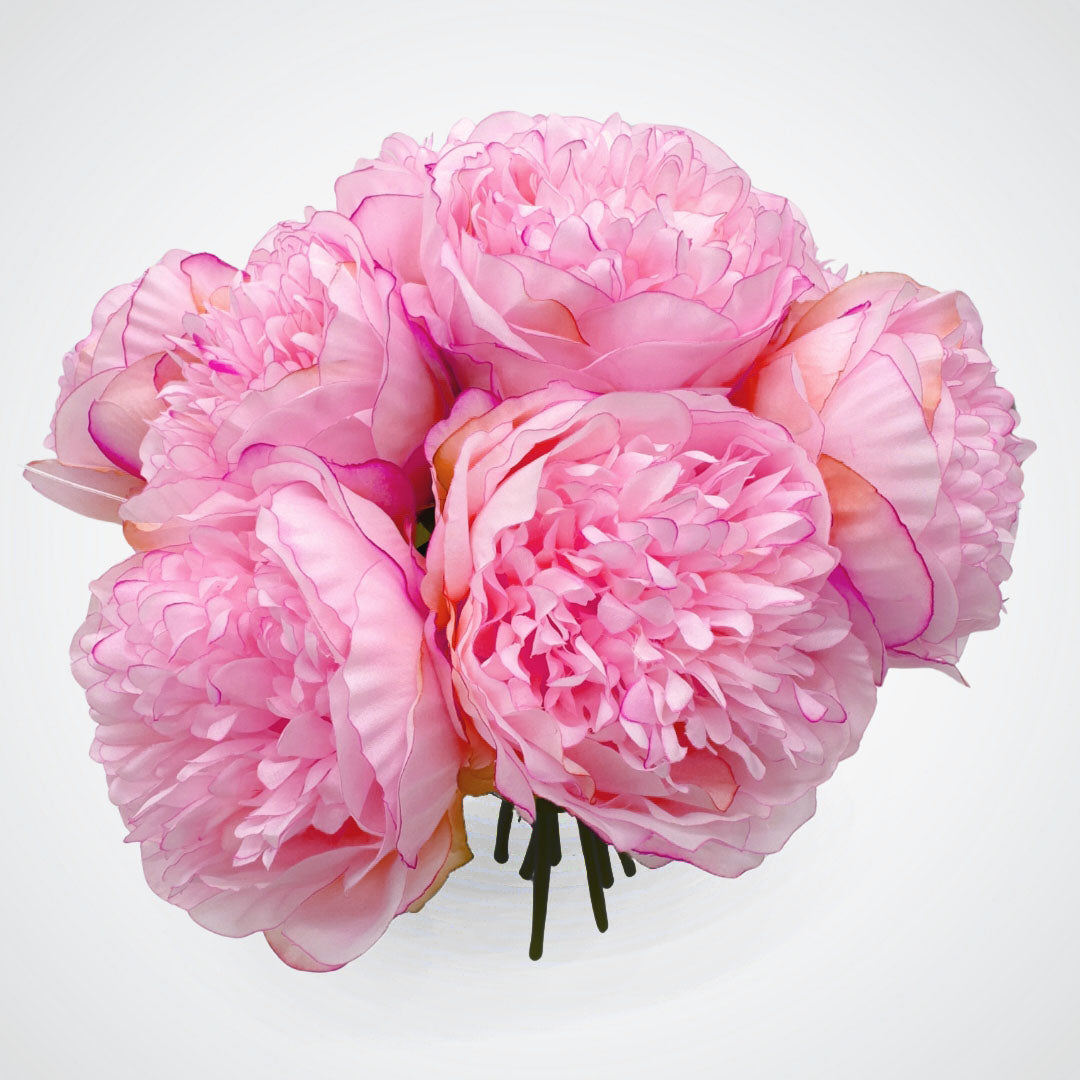 Bouquet of pink faux peonies in front of a white background, by My Faux Florist artificial flowers Canada.