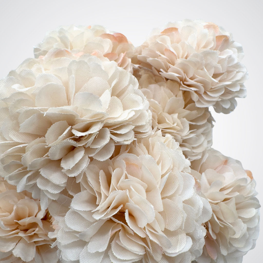 Close up of a bunch of cream-colored artificial chrysanthemum flowers on a white background, by My Faux Florist artificial flowers Canada.
