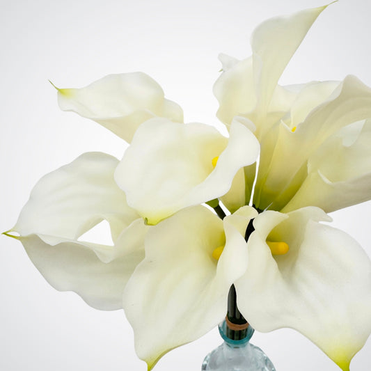 Close up of a bouquet of realistic white realistic artificial lilies with realistic Real Touch petals, from My Faux Florist artificial flowers Canada.