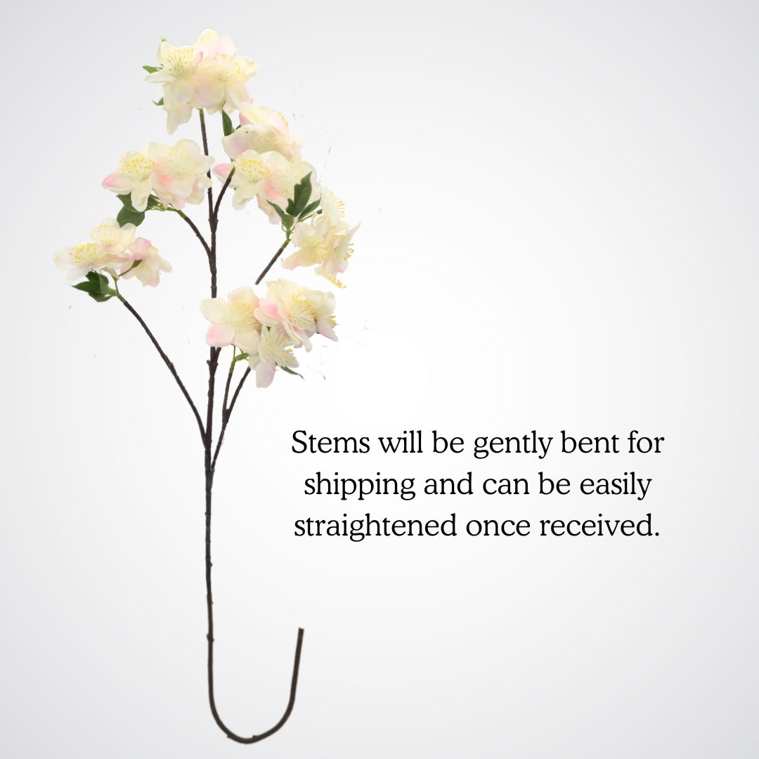 Full view of a bent stem for an artificial apple blossom branch with ivory white blooms and soft yellow pollen tips. The petals are Real Touch and detailed, by My Faux Florist Canada