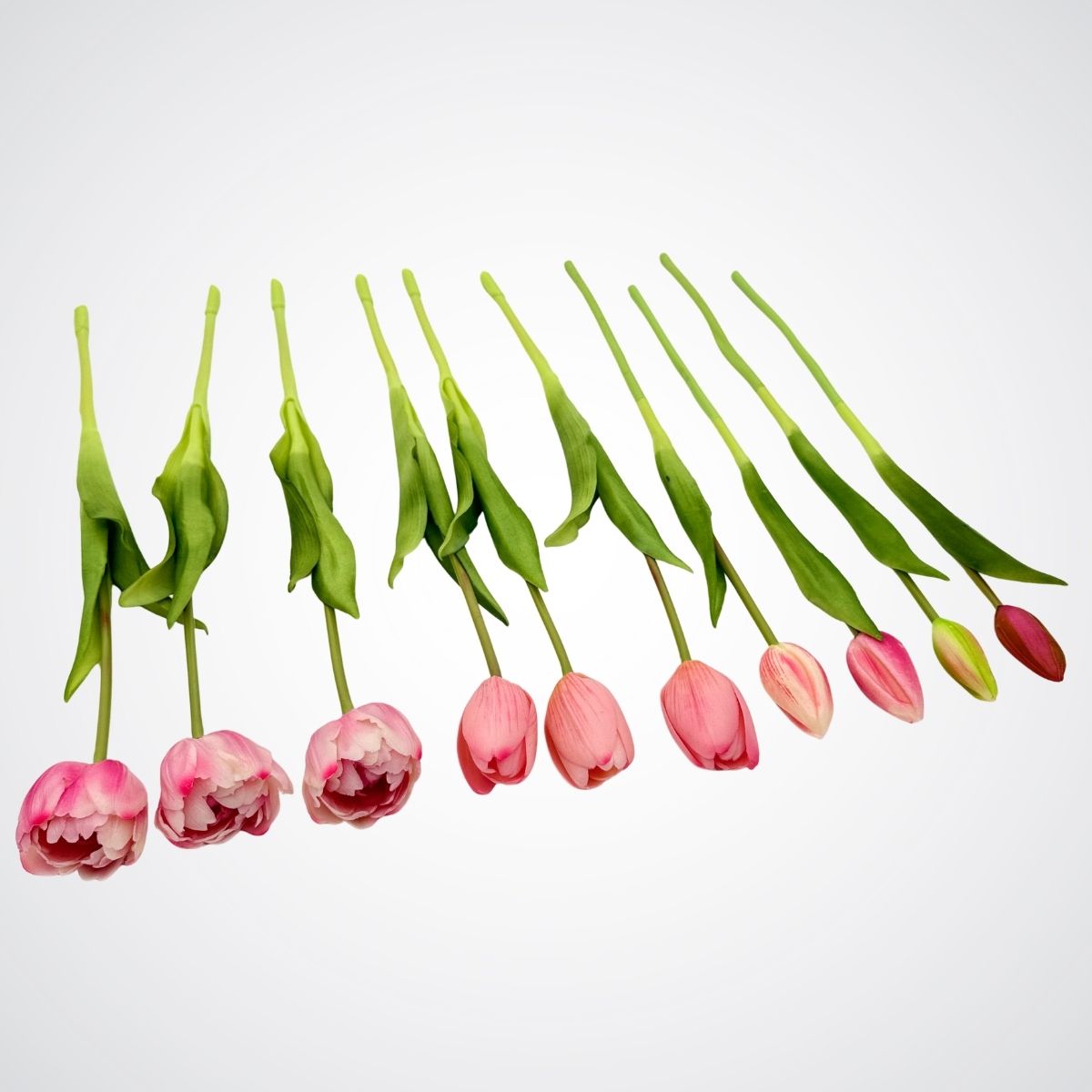 Pink artificial tulips on a light gray background, for My Faux Florist Canada