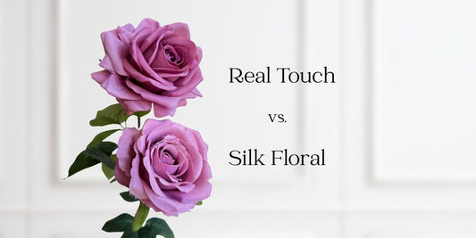 Close up pf 2 mauve artificial flowers. One is Real Touch rose and the other is a silk rose.