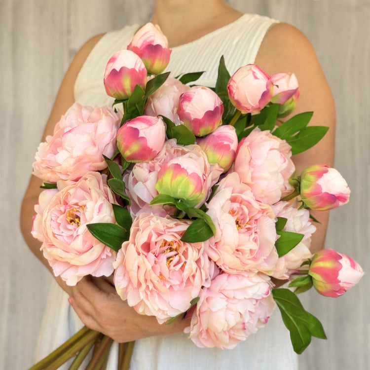 Premium artificial lilies from My Faux Florist – realistic pink faux flowers held in a bouquet