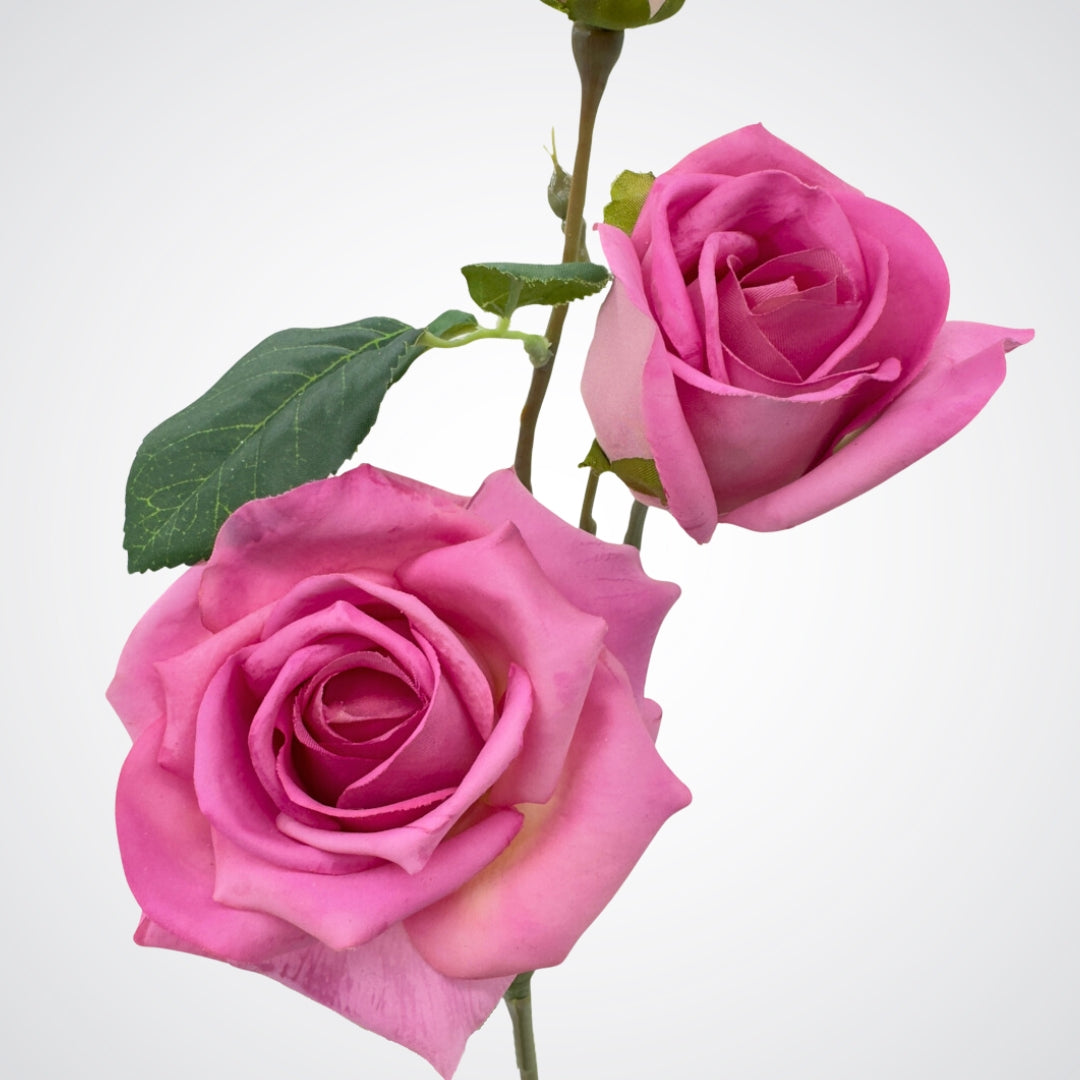 Close up of blooms on mauve artificial rose stem featuring two full 'tea rose' blooms and a delicate Real Touch rosebud with deep pink hues and subtle purple undertones by My Faux Florist.