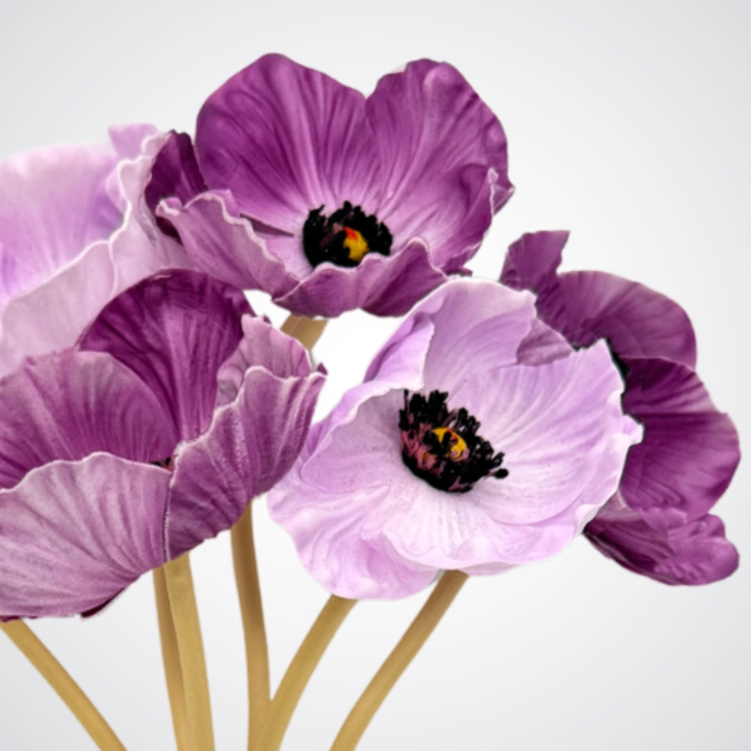 Close-up of purple artificial poppies with a white background from My Faux Florist Canada