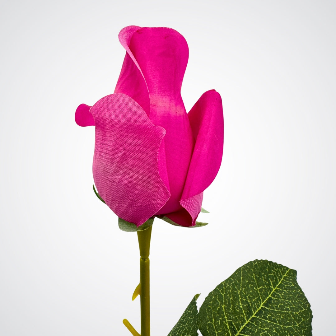 Single bright pink faux rose with a green leaf on a white background from My Faux Florist Canada