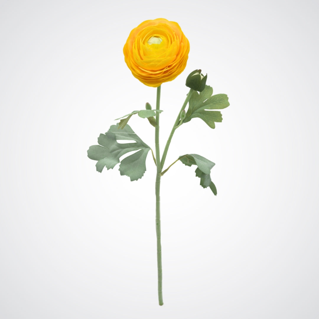 Yellow artificial ranunculus flower with green leaves on a light gray background from My Faux Florist Canada