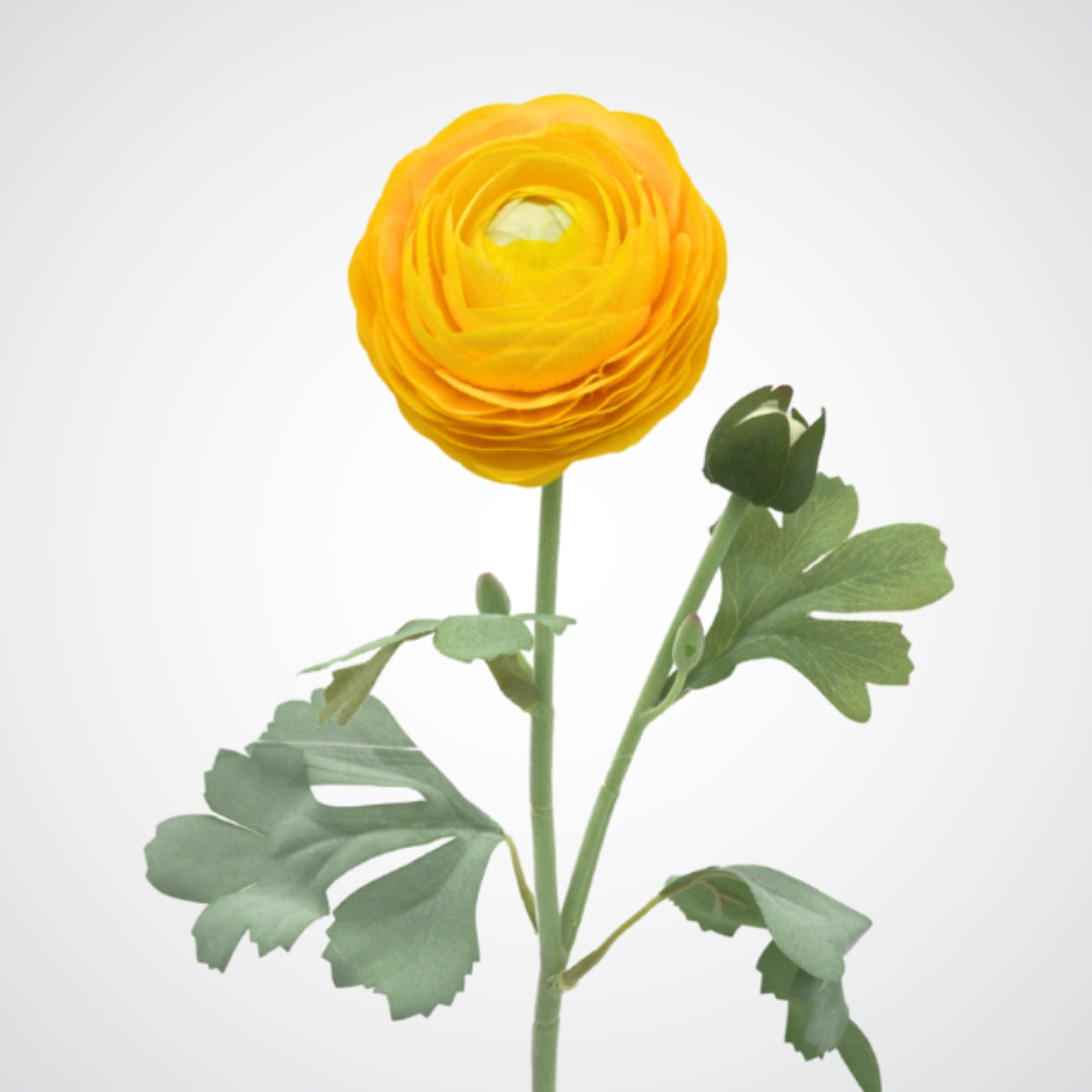 Yellow artificial ranunculus flower with green leaves on a white background from My Faux Florist Canada