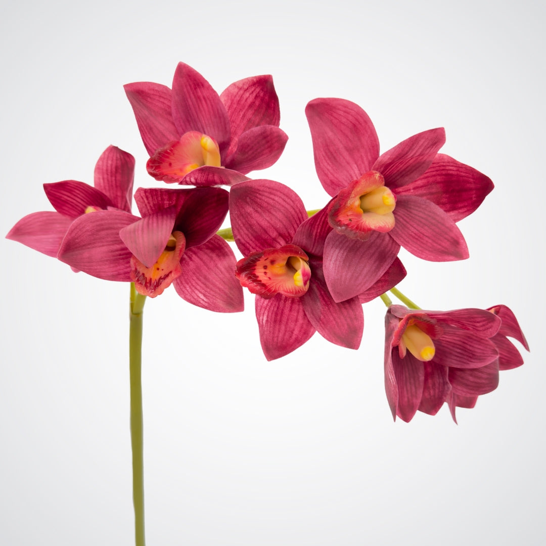 Burgundy fake orchid stem on a white background from My Faux Florist Canada
