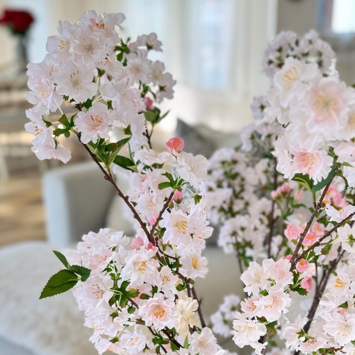 White vase with pink cherry blossom artificial flowers close up, for My Faux Florist Canada.
