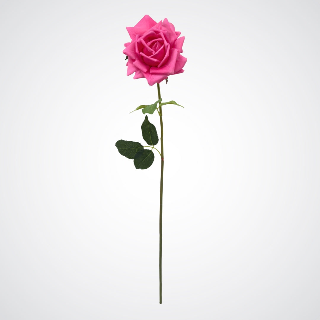 Single artificial flower on white background.  Full length view of realistic fuchsia pink artificial rose with realistic Real Touch bloom.