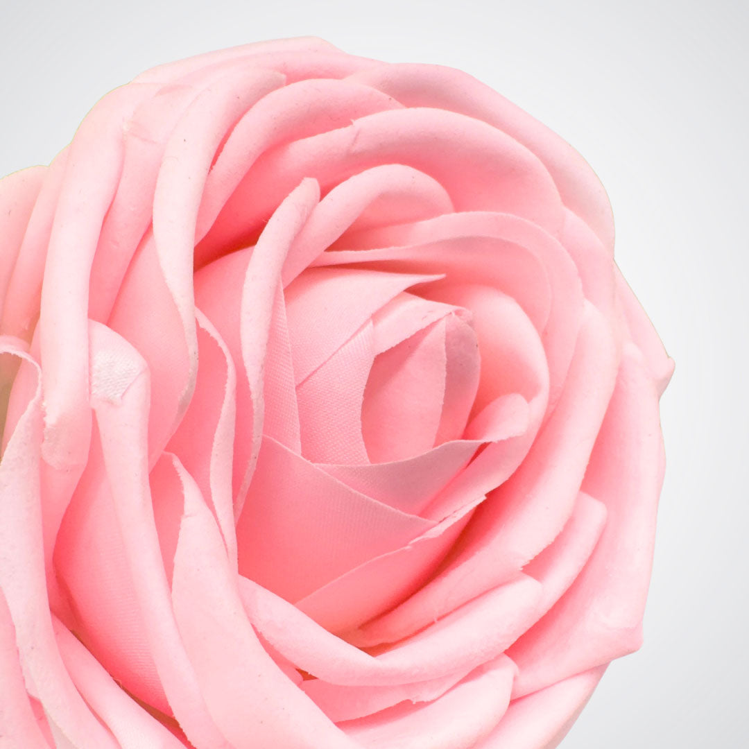 Close-up of a pink artificial rose on a white background from My Faux Florist Canada