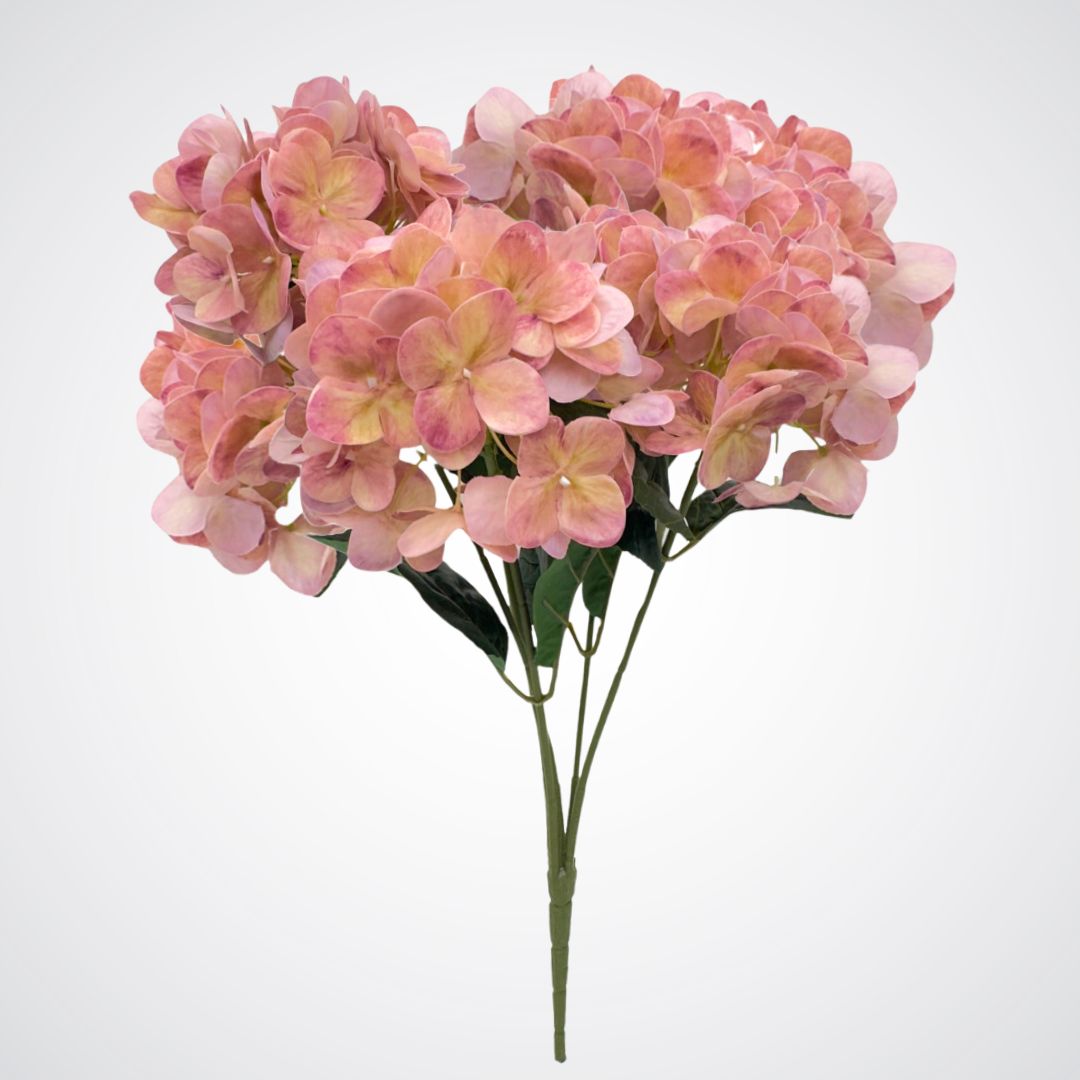 Full length view of a medium pink artificial hydrangea bush with subtle purple undertones and realistic Real Touch veining. Realistic fake flowers by  My Faux Florist Canada