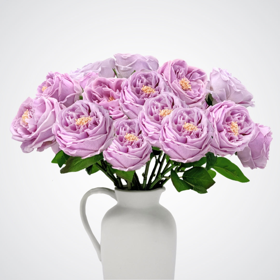 white vase full of Austin style artificial roses in a lilac lavender colour with realistic Real Touch petals, from My Faux Florist artificial flowers Canada.