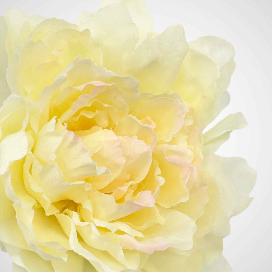 Close-up of a fully ruffled artificial ivory peony bloom with pink accents, by Faux Florist Canada