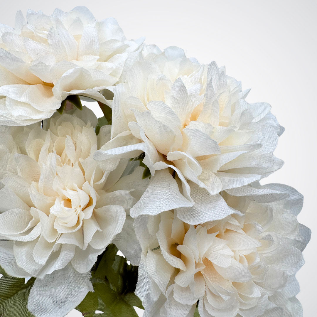 Close up view of an ivory artificial dahlia bush with full, round-shaped petals by My Faux Florist Canada