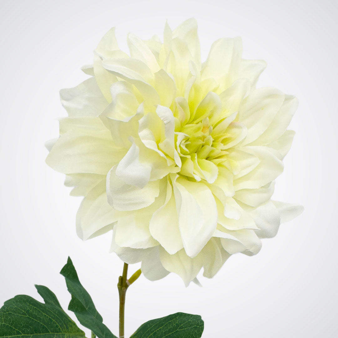 Side view of bloom from a white artificial dahlia flower on a gray background from My Faux Florist Canada.