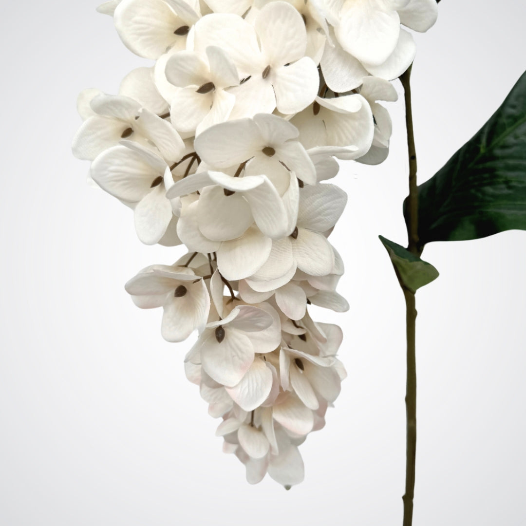 Close up of blooms from an artificial wisteria branch in white, by My Faux Florist artificial flowers Canada.