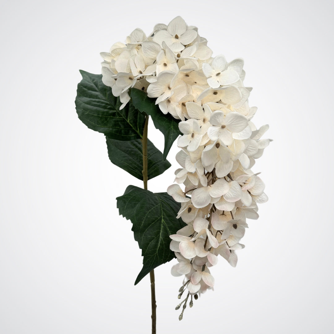 Draping bloom head of an artificial wisteria branch in white, by My Faux Florist artificial flowers Canada.