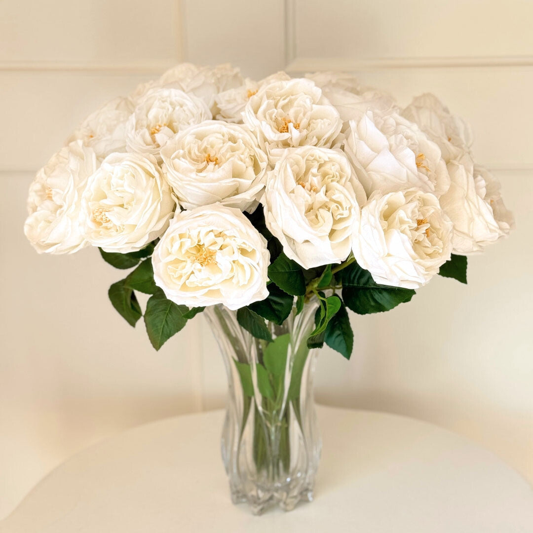 Clear vase full of white Austin rose style realistic artificial roses with realistic Real Touch petals, from My Faux Florist artificial flowers Canada.