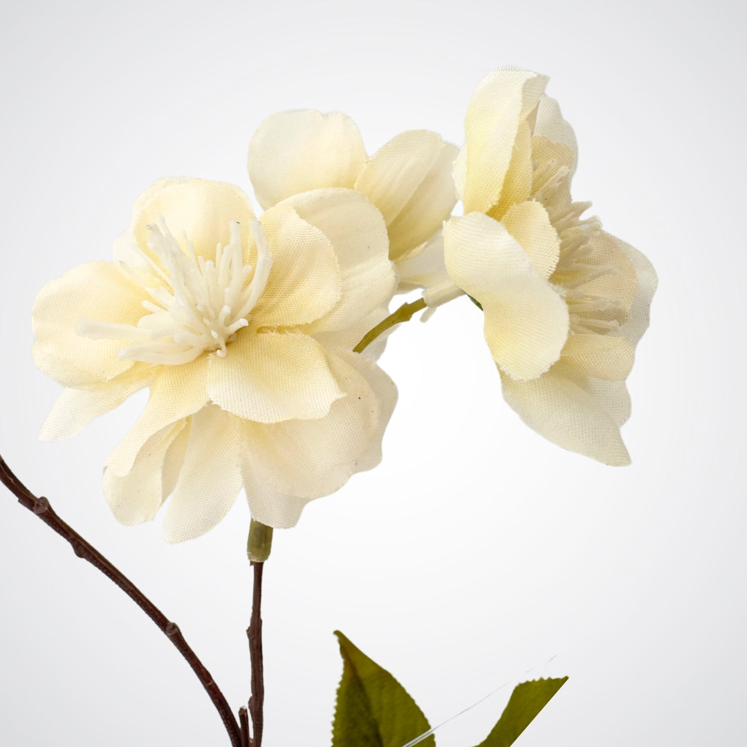 Close up view of 2 blooms on an artificial apple blossom branch with ivory white blooms and soft yellow pollen tips.  The petals are Real Touch and detailed, by My Faux Florist Canada