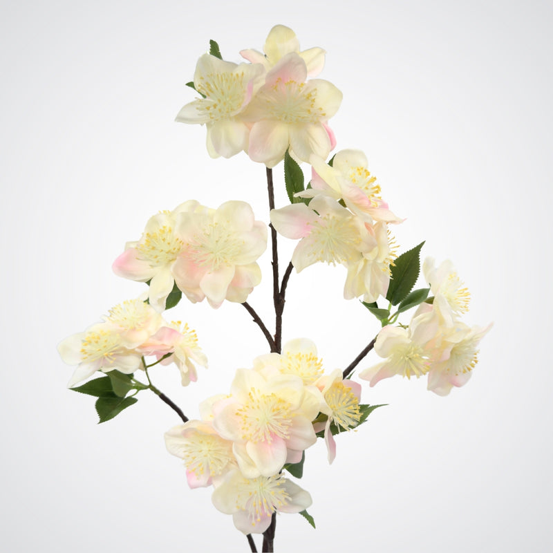 Close view of multiple blooms on an artificial apple blossom branch with ivory white blooms and soft yellow pollen tips.  The petals are Real Touch and detailed, by My Faux Florist Canada