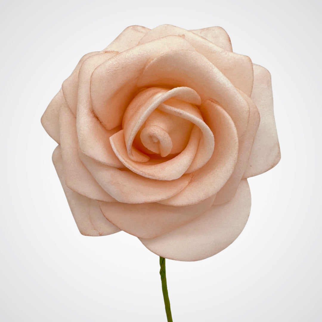 Close up of a single wire peach artificial roses made of foam on a white background from My Faux Florist Canada.