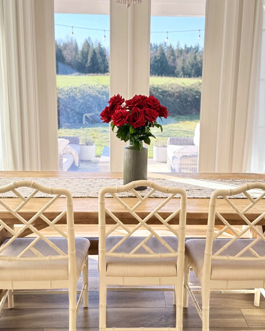 Photo of a vase of red artificial roses on  a dining  table, for My Faux Florist Canada