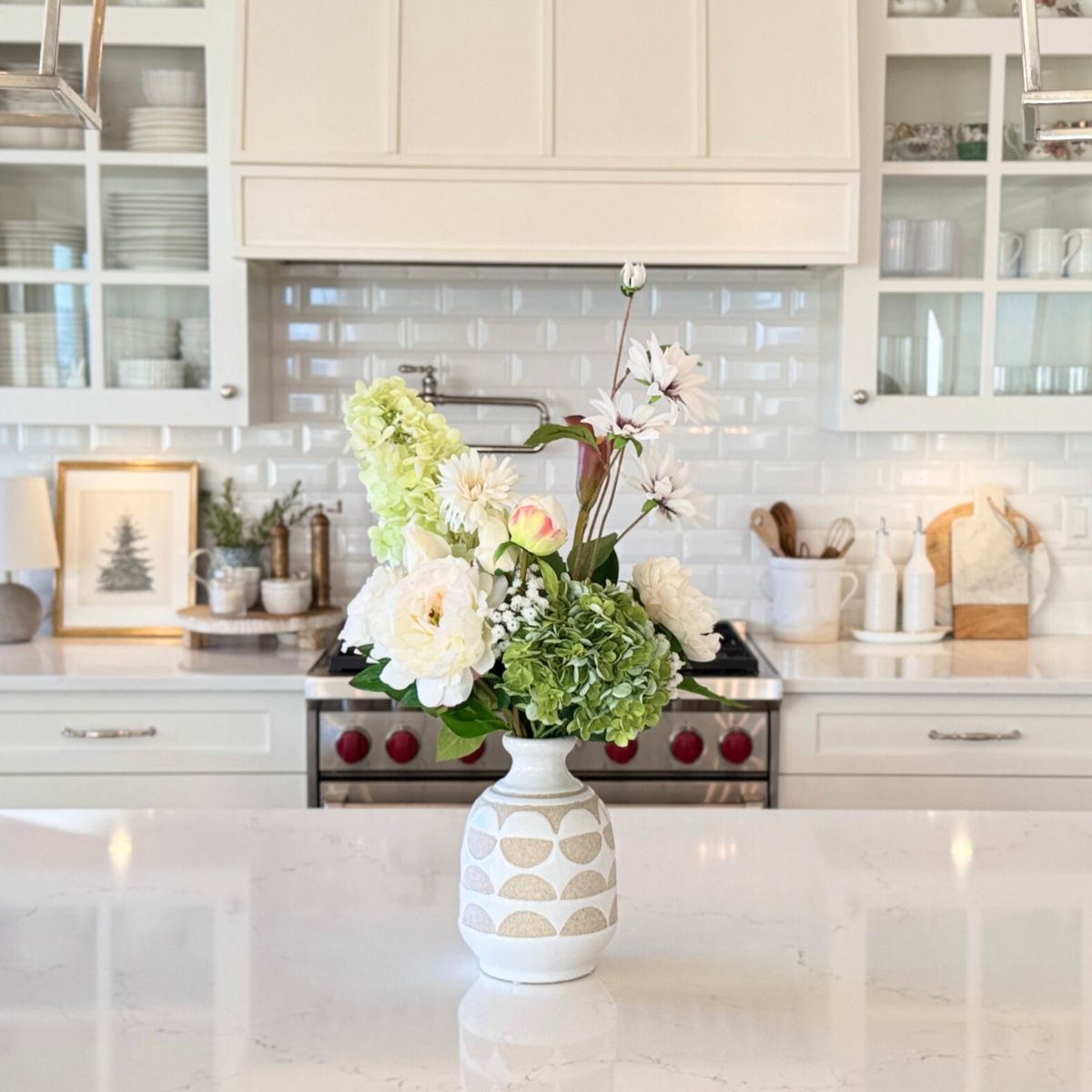 Floral arrangement of artificial flowers in a vase on a kitchen counter, for My Faux Florist Canada