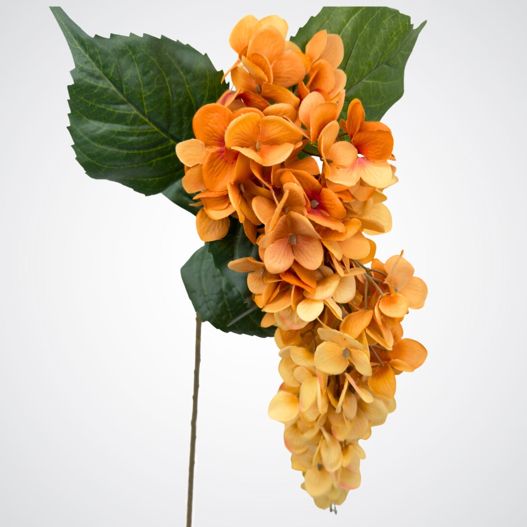 Draping bloom head of an artificial wisteria branch in ombre orange and bronze colours, by My Faux Florist artificial flowers Canada.