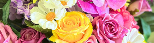 Close-up of colorful artificial flowers including fake roses and artificial daisies and Real Touch flowers by My Faux Florist artificial flowers Canada.
