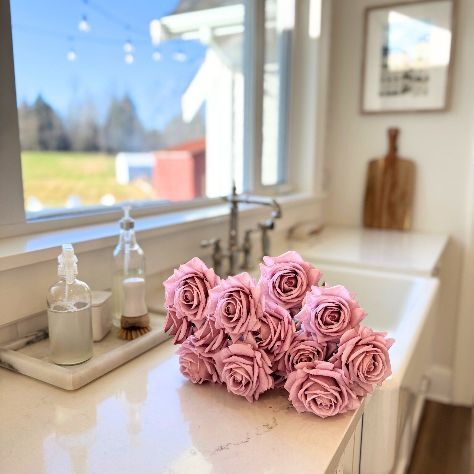 Antique Pink | Real Touch artificial roses on a kitchen counter with a window in the background | for My Faux Florist Canada