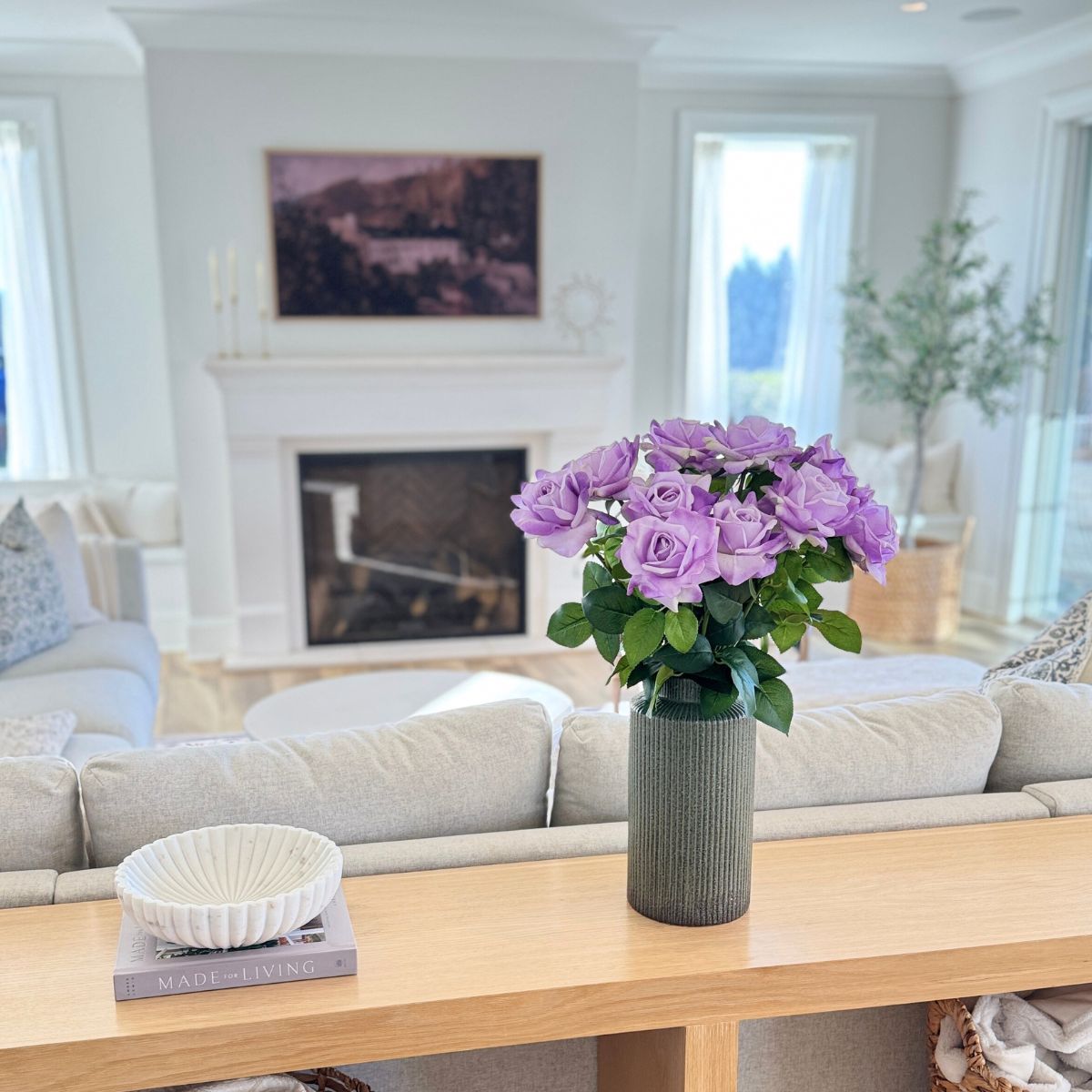 Lilac | Realistic Purple Real Touch artificial roses in a vase in front of a warm living room | for My Faux Florist Canada