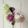 Turntable showcasing  a realistic artificial flower bouquet for bridesmaids featuring pale green artificial hydrangeas, mauve artificial roses, blush artificial peonies, white artificial allium, and deep wine artificial calla lilies — from My Faux Florist Canada.