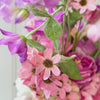 Turntable showcasing a realistic artificial flower bridal bouquet featuring purple artificial orchids, pink artificial cosmos, champagne artificial tea roses, blush artificial peonies, white artificial hydrangeas, mauve artificial dahlias, and pink artificial tulips — from My Faux Florist Canada.