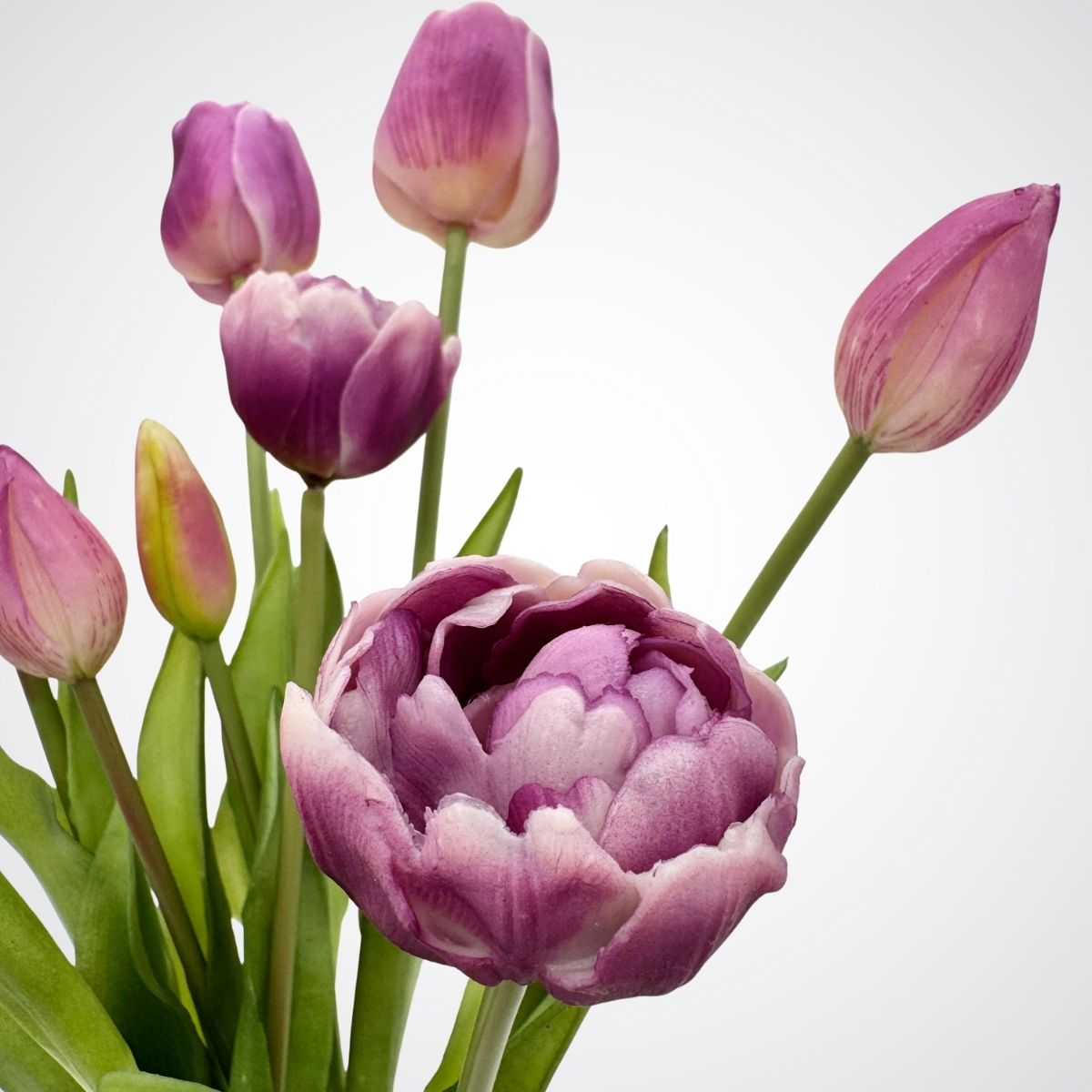 Bouquet of purple artificial tulips on a light gray background, for My Faux Florist Canada