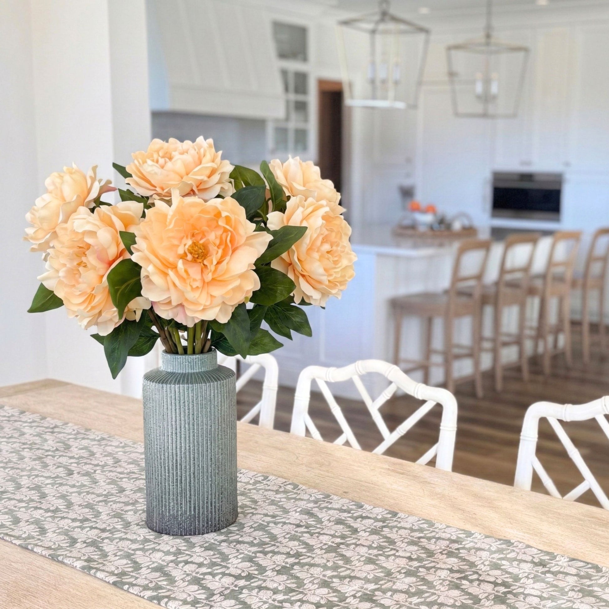 green vase full of realistic artificial peonies in peach colour, for my Faux Florist Canada