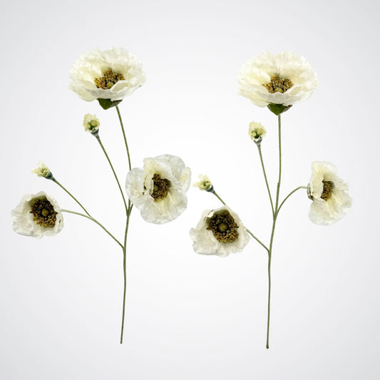 White realistic artificial poppy flowers with dark centers and green stems, arranged on a plain light gray background. For My Faux Florist Canada.
