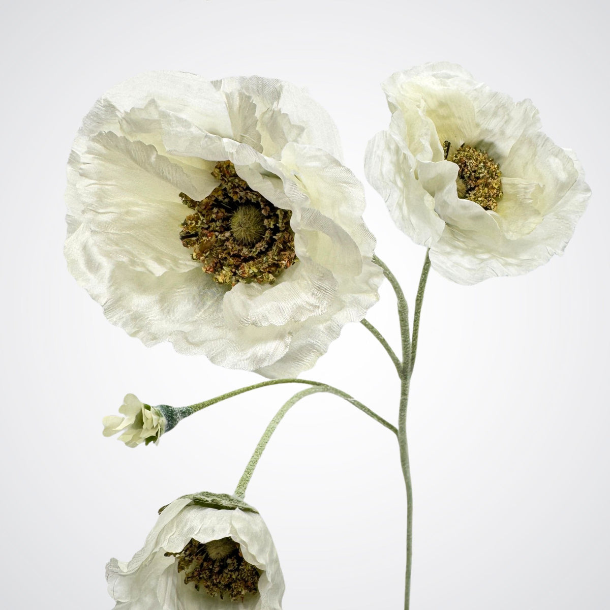 Three realistic artificial white poppy flowers with textured, crinkled petals and dark brown centers on a light gray background. For My Faux Florist Canada.