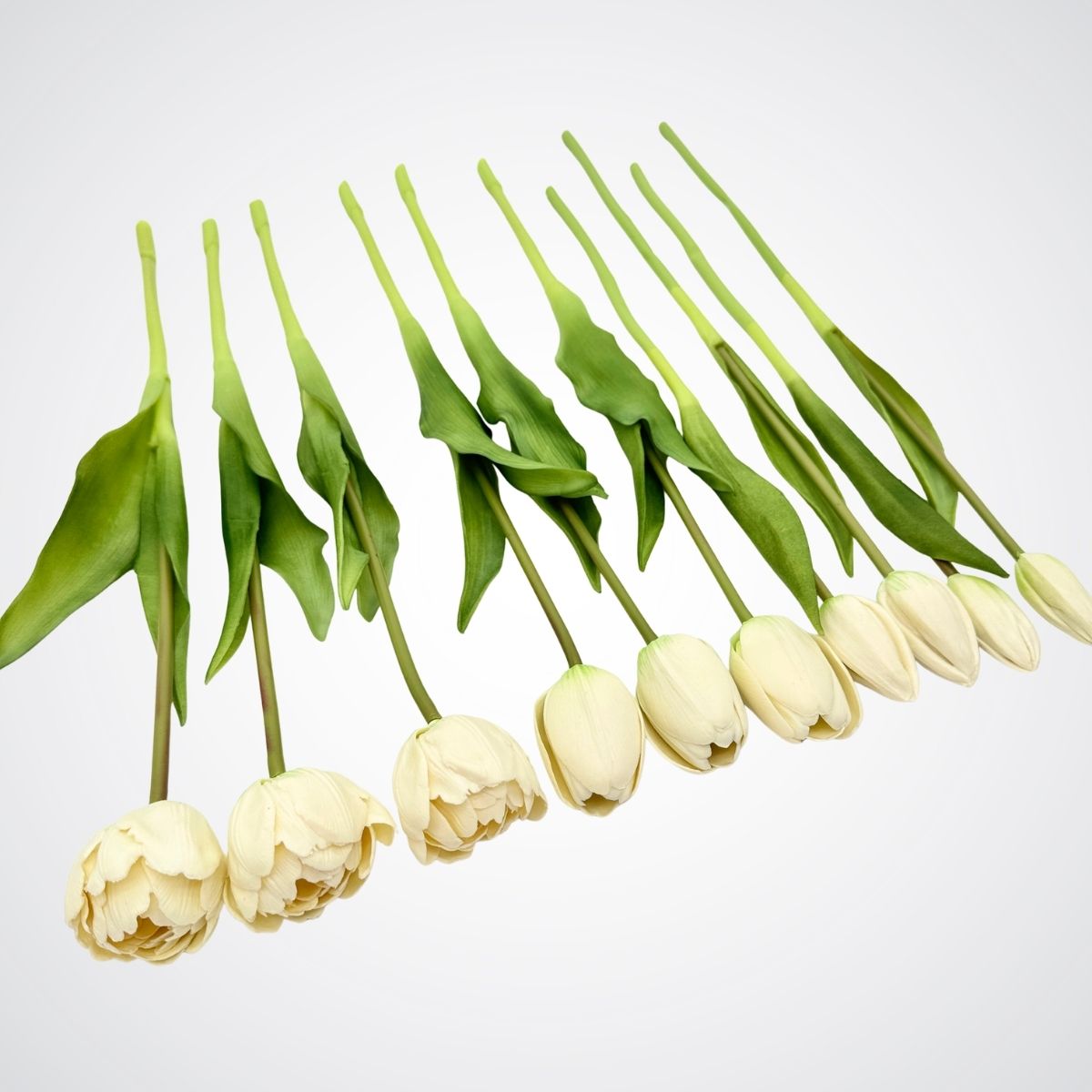 white artificial tulips on a light gray background, for My Faux Florist Canada