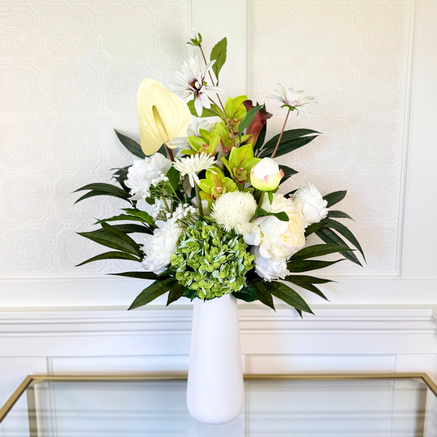 Bouquet of neutral coloured artificial flowers and Real Touch flowers in front of a white wall, by My Faux Florist artificial flowers Canada.