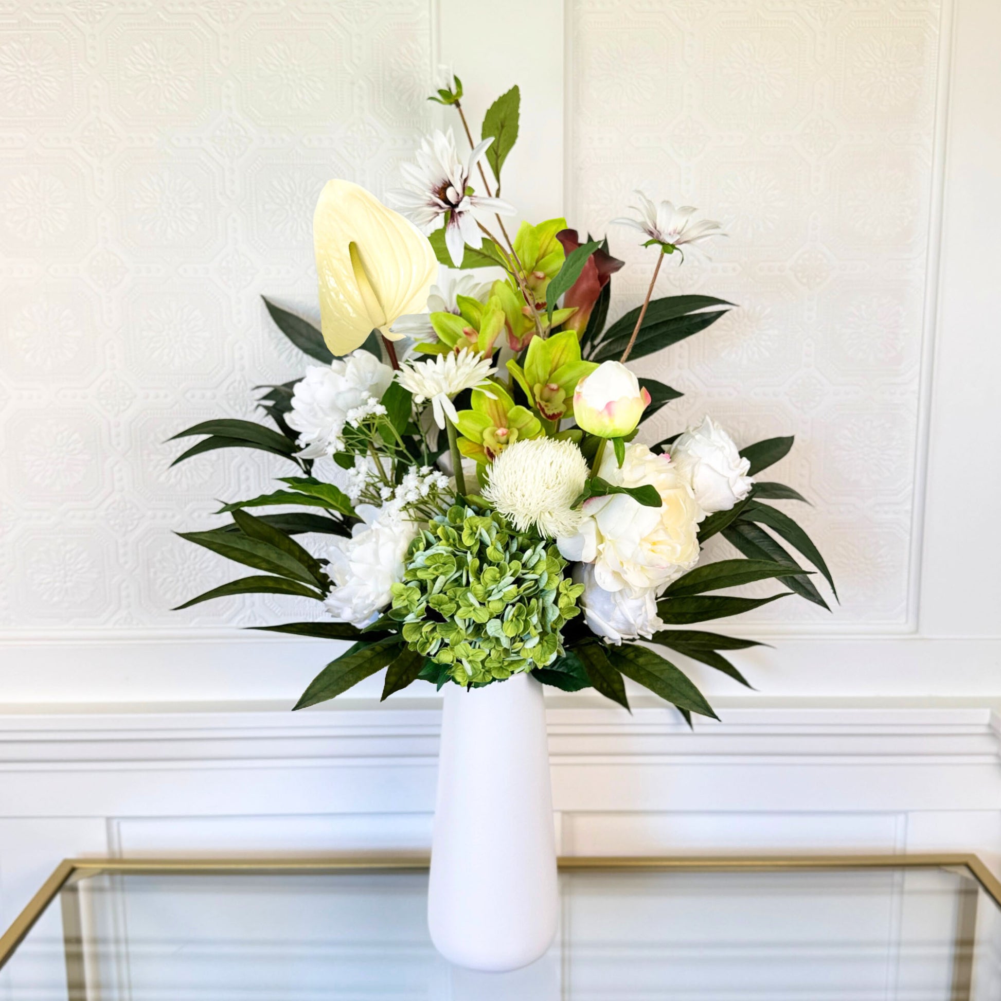 Bouquet of neutral coloured artificial flowers and Real Touch flowers in front of a white wall, by My Faux Florist artificial flowers Canada.