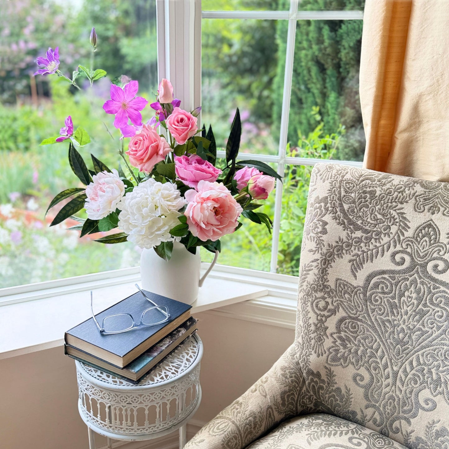 Bouquet of brightly coloured artificial flowers and Real Touch flowers in a window, by My Faux Florist artificial flowers Canada.