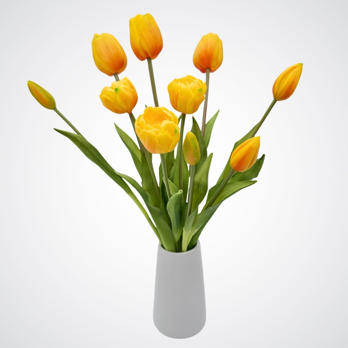 Bouquet of yellow artificial  tulips in a white vase on a light gray background, for My Faux Florist Canada